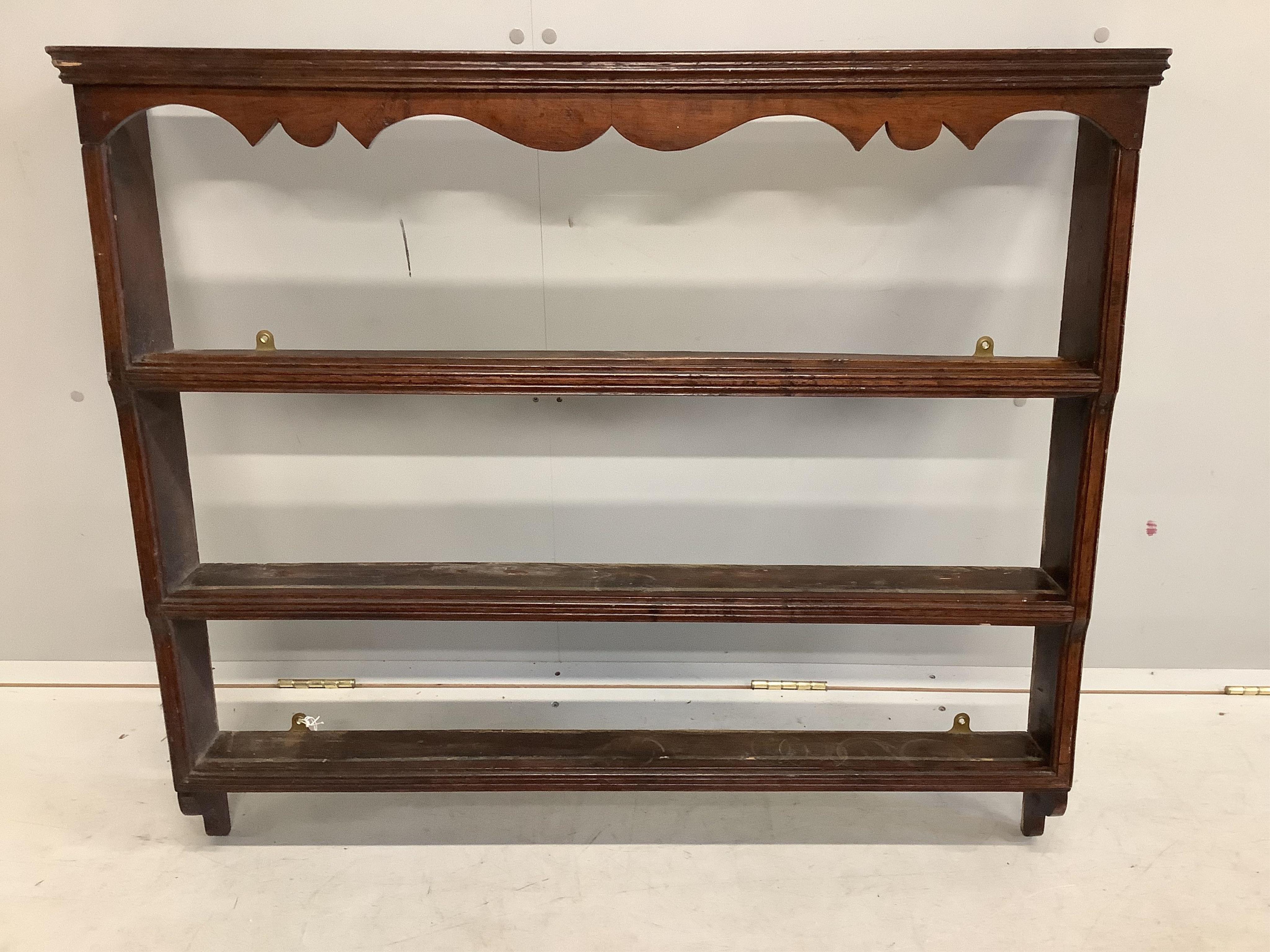 A small 18th century oak plate rack, width 103cm, height 90cm. Condition - fair